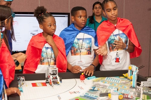 Atwell's Hydro Heroes in full cape crusader get up, present their robot to the Robot Design judges